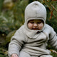 Mikk Line Pasamontañas infantil de lana merino  Melange Offwhite